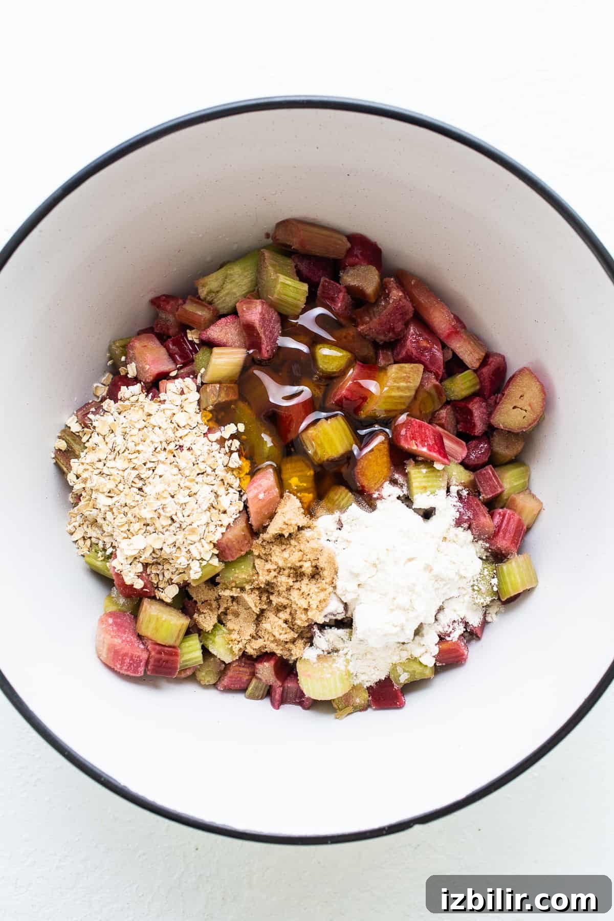 Honey Rhubarb Crisp Recipe with Brown Butter Oat Topping 3 Rhubarb and oats in a bowl ready for mixing