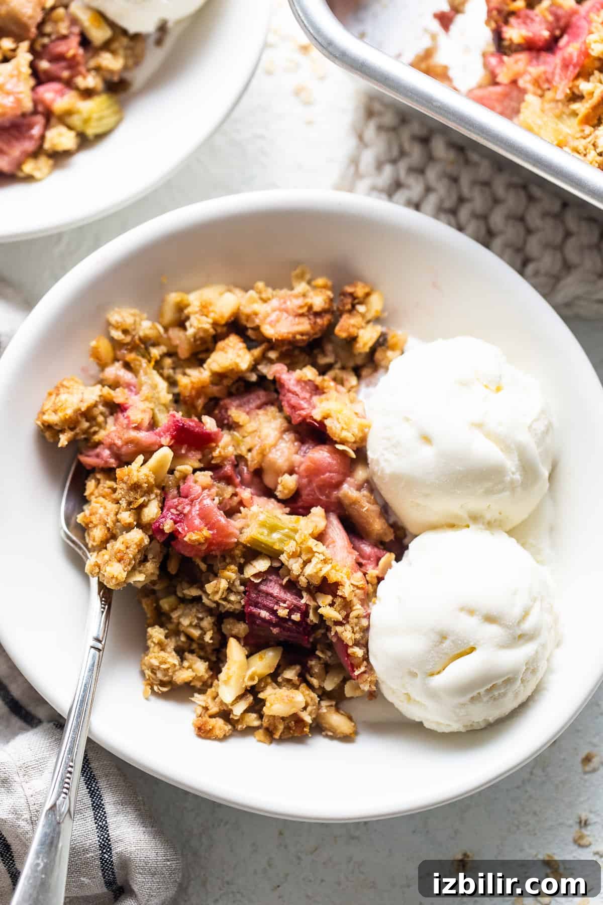 Honey Rhubarb Crisp Recipe with Brown Butter Oat Topping 6 Rhubarb crisp served with ice cream and berries