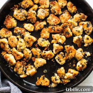 Chicken nuggets in a skillet.