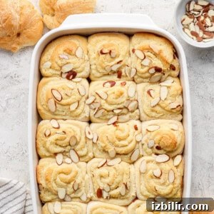 Almond-topped sweet rolls in a baking dish