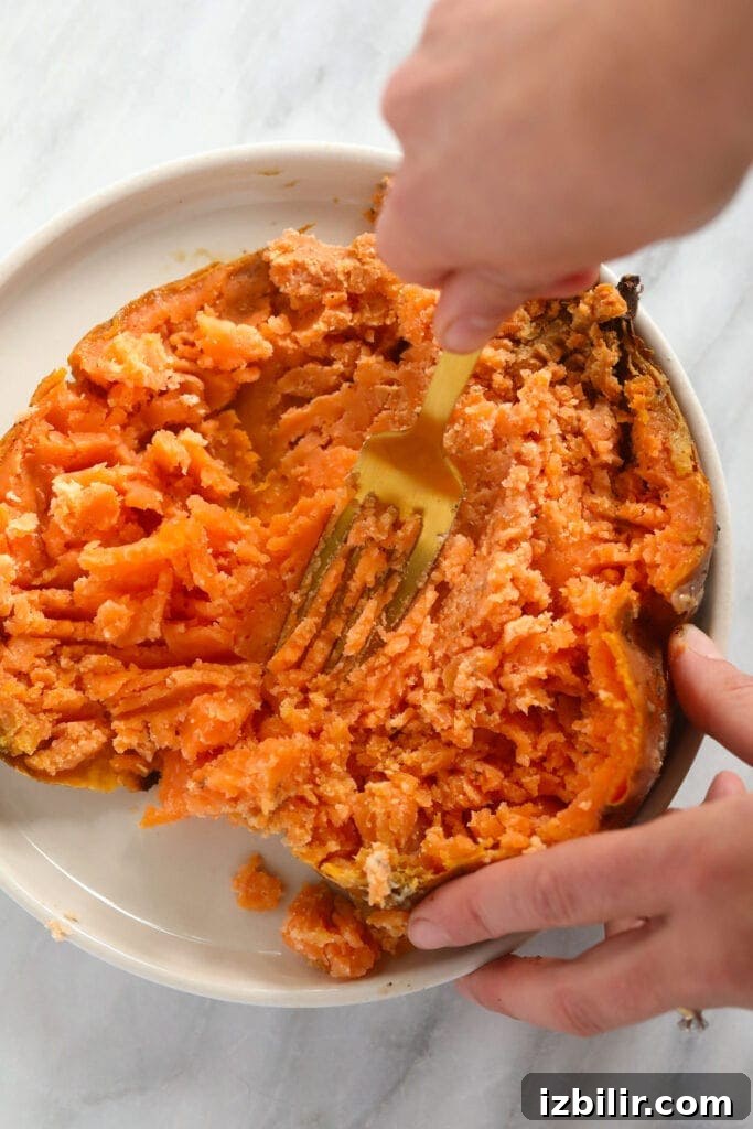 Fluffy Sweet Potato Pancakes Recipe 3 Making sweet potato puree out of a baked sweet potato.