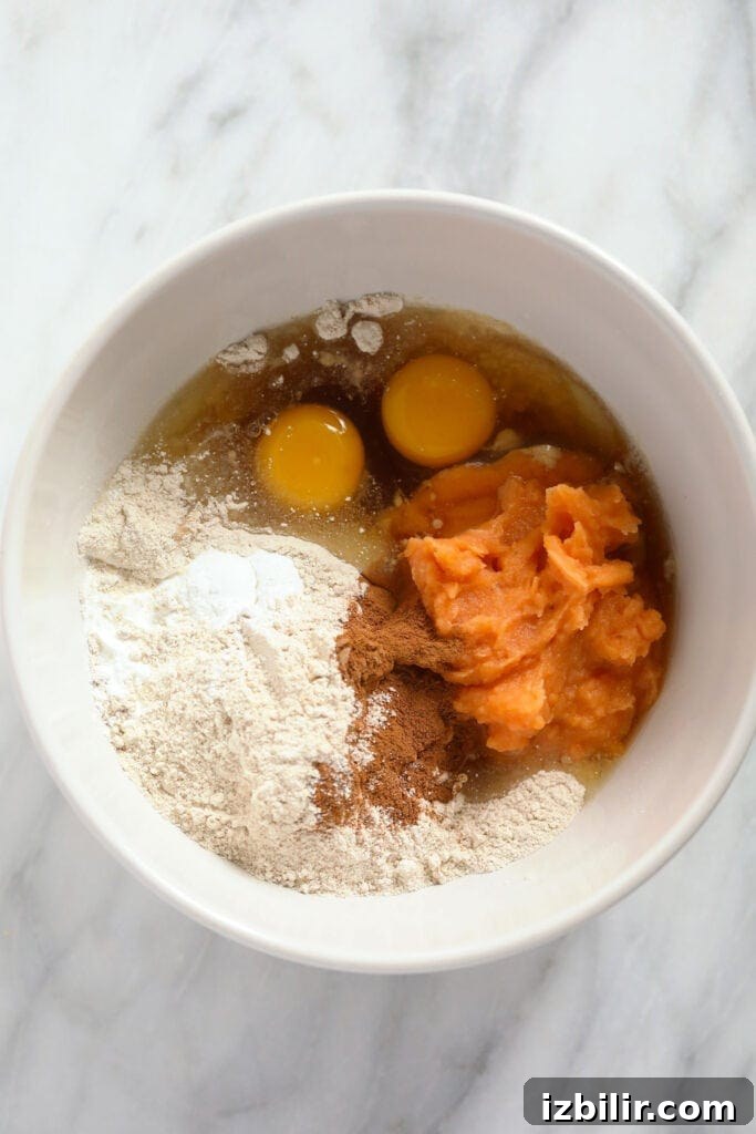 Fluffy Sweet Potato Pancakes Recipe 4 Ingredients for sweet potato pancakes in a bowl.