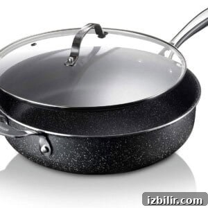 A black pot with a lid on a white background.