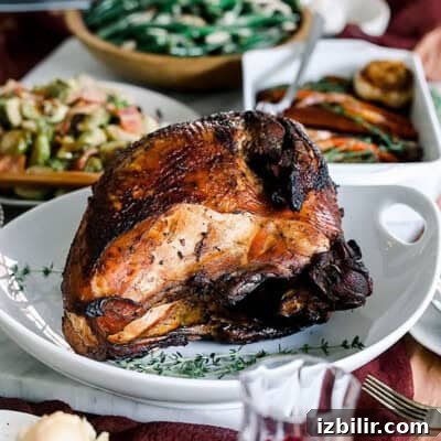 Thanksgiving dinner with Sous Vide turkey and roasted vegetables on a table.
