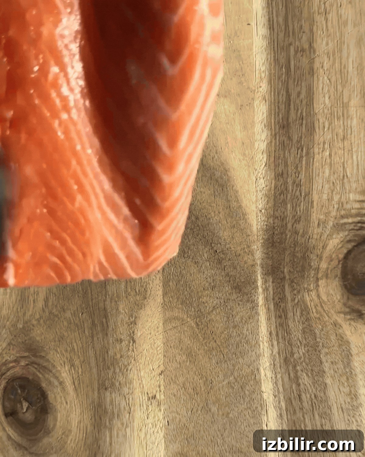 Slicing a large filet of salmon so that you can stuff it