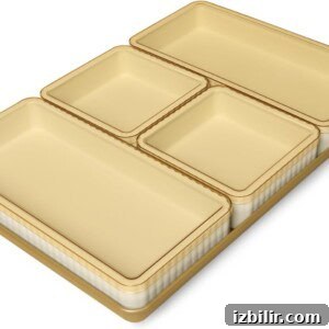 Sheet-Pan Thanksgiving Dinner for 4: Complete One-Tray Menu 7 Four rectangular beige nested storage containers in different sizes, arranged neatly on a flat surface—perfect for organizing ingredients before your sheet pan Thanksgiving dinner.