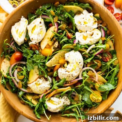 Thanksgiving Sides Worth Serving (Everything But Turkey) 13 Apple burrata salad in a bowl.