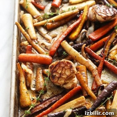 Thanksgiving Sides Worth Serving (Everything But Turkey) 23 roasted carrots and garlic on a baking tray