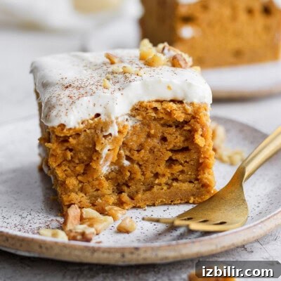 Thanksgiving Sides Worth Serving (Everything But Turkey) 38 slice of pumpkin sheet cake on a plate