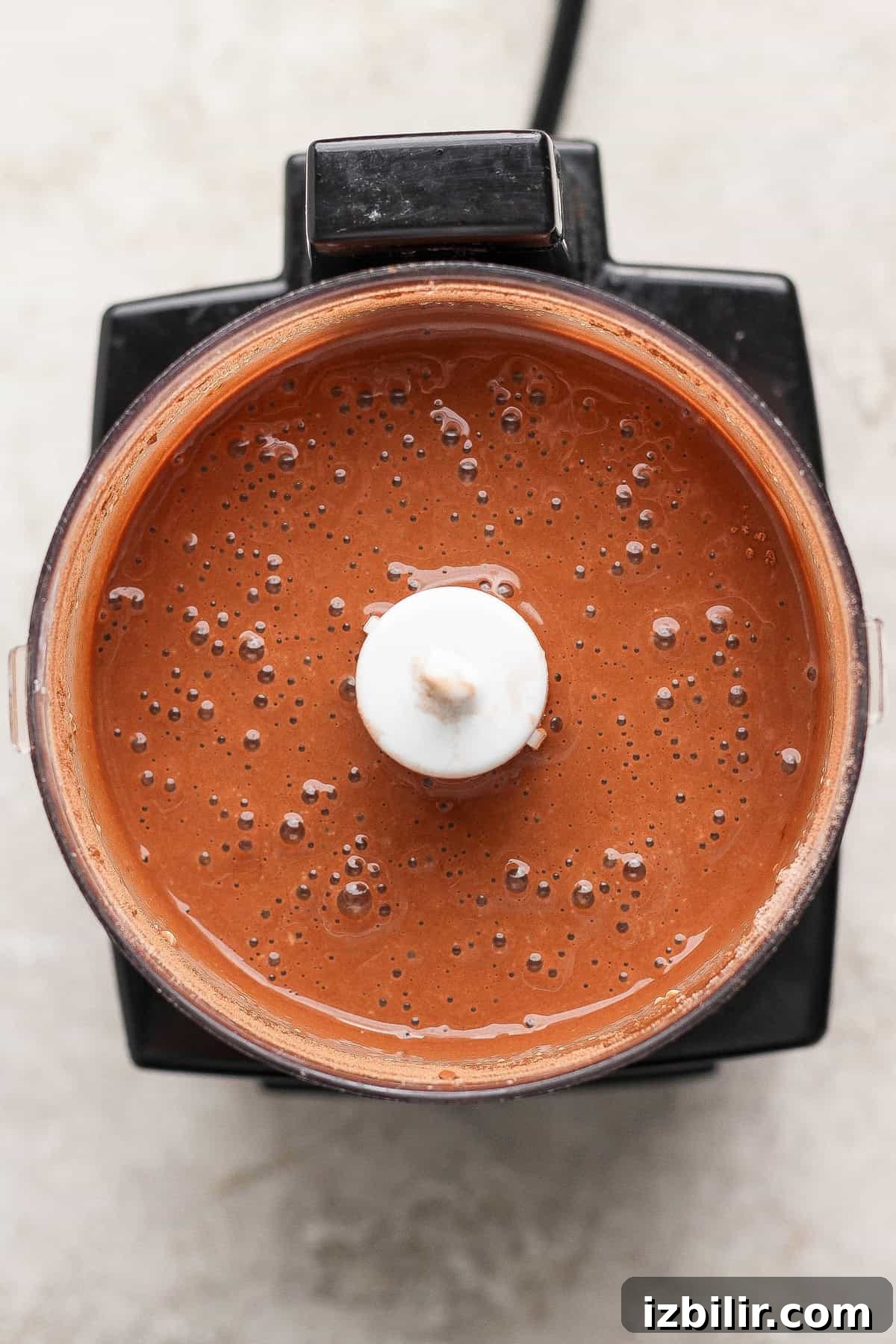 Single Serve Cottage Cheese Brownie Recipe for One 4 A blender filled with smooth, chocolate-colored liquid viewed from above.