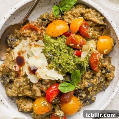 10 High-Protein Spring Recipes to Refresh Your Menu 8 A bowl of risotto with tomatoes and pesto.