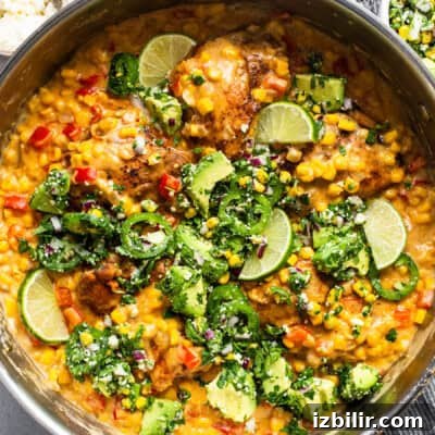 Chicken and corn risotto in a pan.