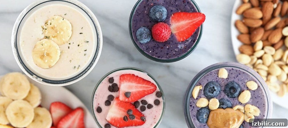 Creamy Peanut Butter and Jelly Smoothie Recipe 6 protein shakes on counter.