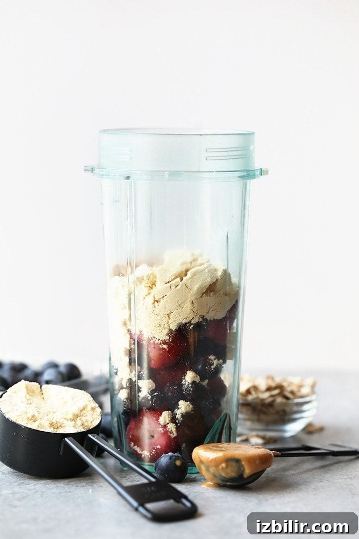 Creamy Peanut Butter and Jelly Smoothie Recipe 3 pbj smoothie in blender.