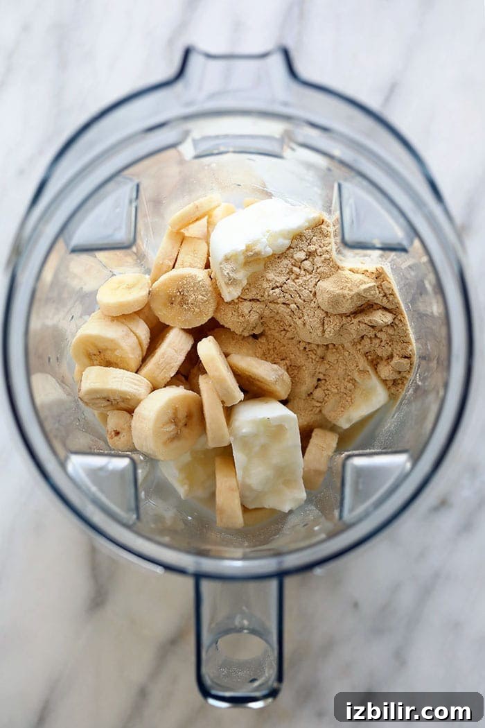 healthy banana protein shake ingredients in a blender