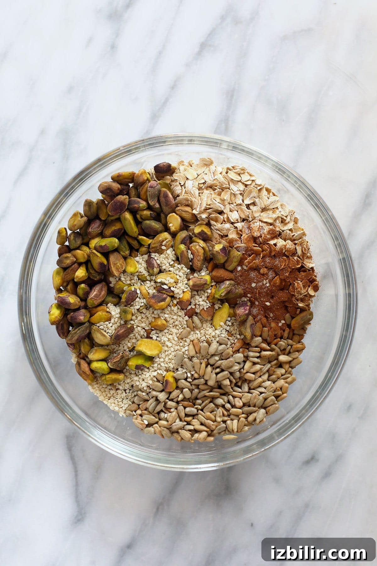 Homemade Pistachio Cherry Granola 3 All of the ingredients for pistachio cherry granola in a bowl.