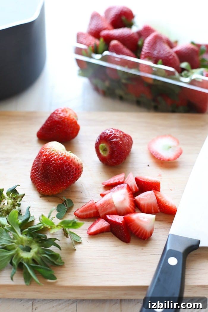Fresh strawberries for compote Strawberries on cutting board.