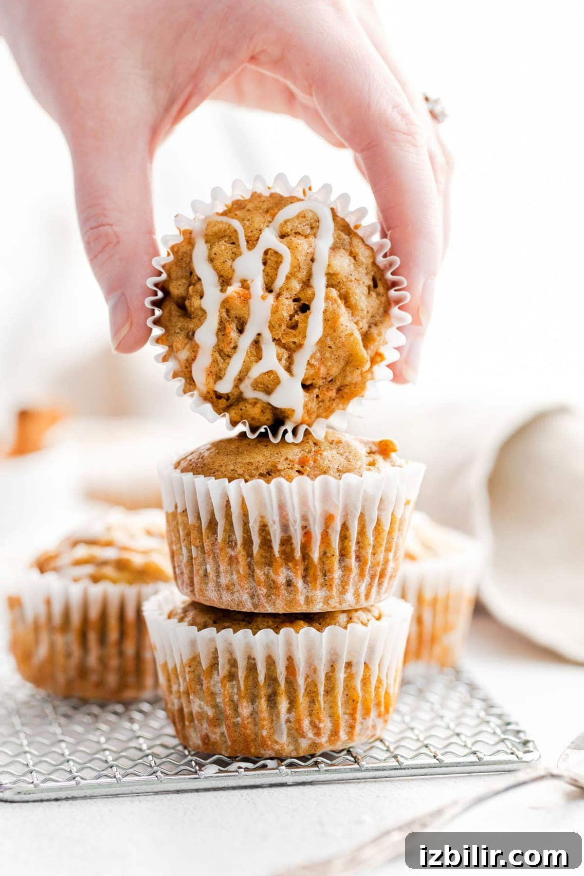 Carrot Cake Muffins are truly delicious any time of year. Our carrot cake muffins recipe is made with whole-grain flour, grated carrots, warm spices, maple syrup and chopped walnuts. carrot cake muffins