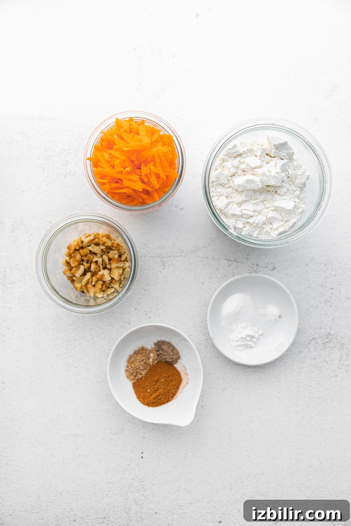 Take your muffin game up a notch with these easy whole grain carrot cake muffins. They're kid-friendly, naturally sweetened, and the perfect snack! Make a batch today! carrot muffin ingredients