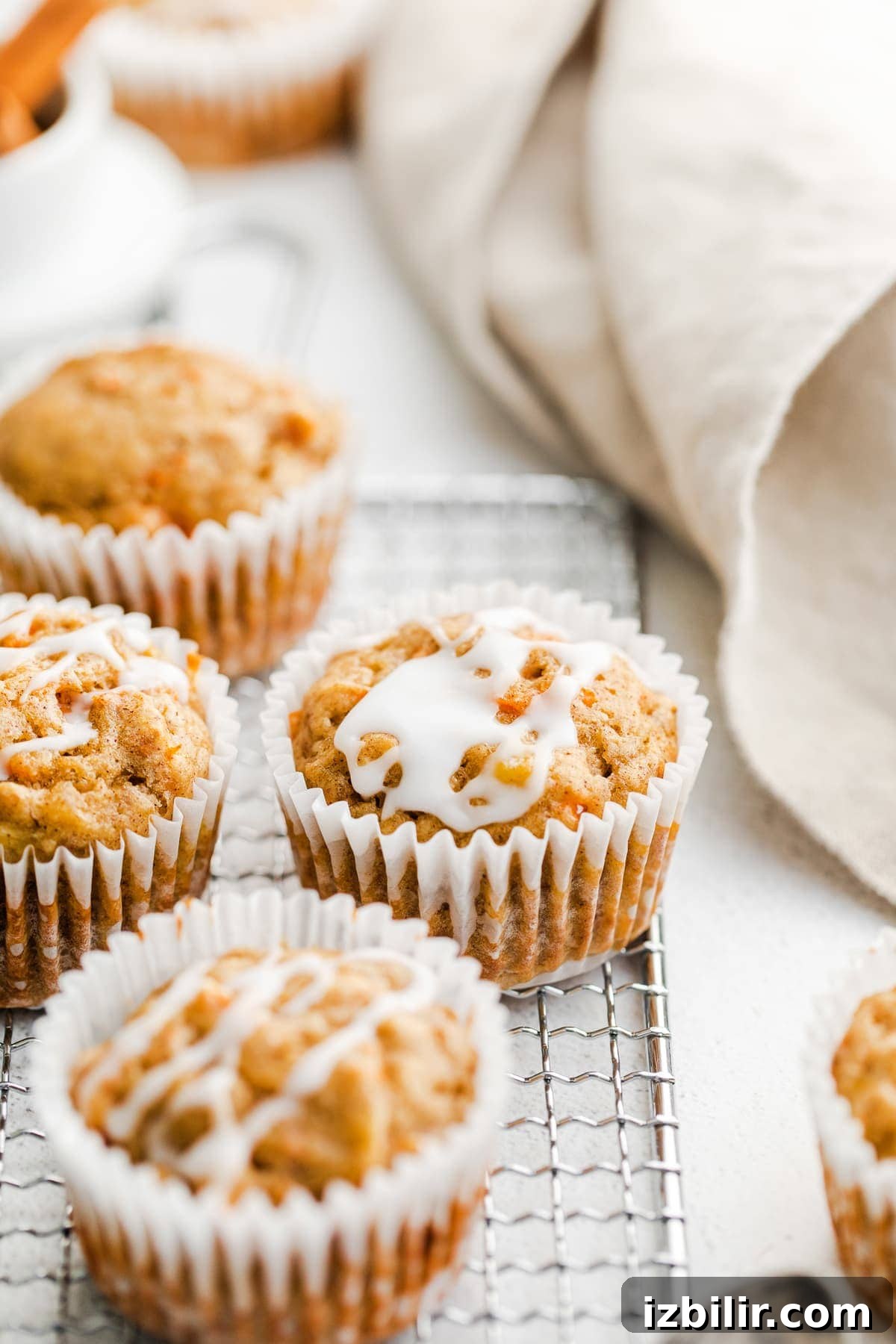 Carrot Cake Muffins are truly delicious any time of year. Our carrot cake muffins recipe is made with whole-grain flour, grated carrots, warm spices, maple syrup and chopped walnuts. carrot cake muffins