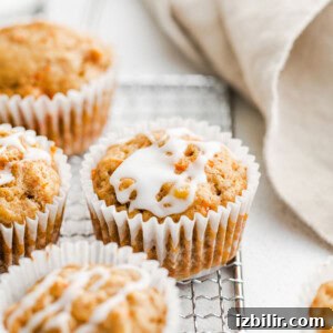 Moist Carrot Cake Muffins Recipe with Cream Cheese Frosting 3 Carrot muffins cooling.