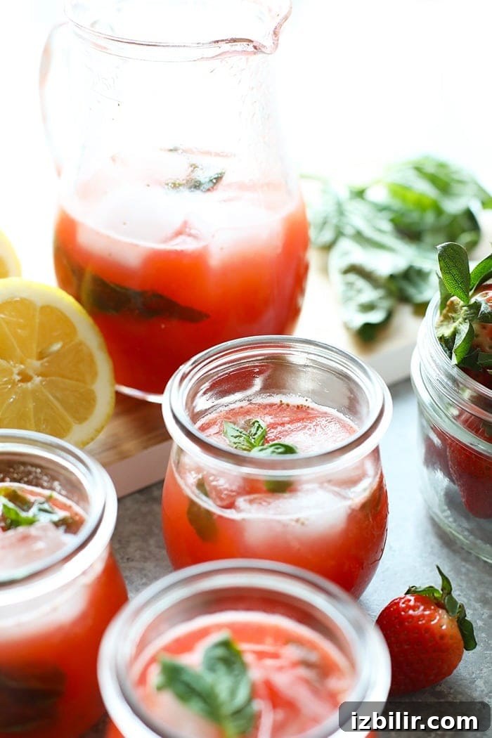 Refreshing Homemade Strawberry Lemonade Recipe 2 homemade strawberry basil lemonade in glasses ready to be enjoyed