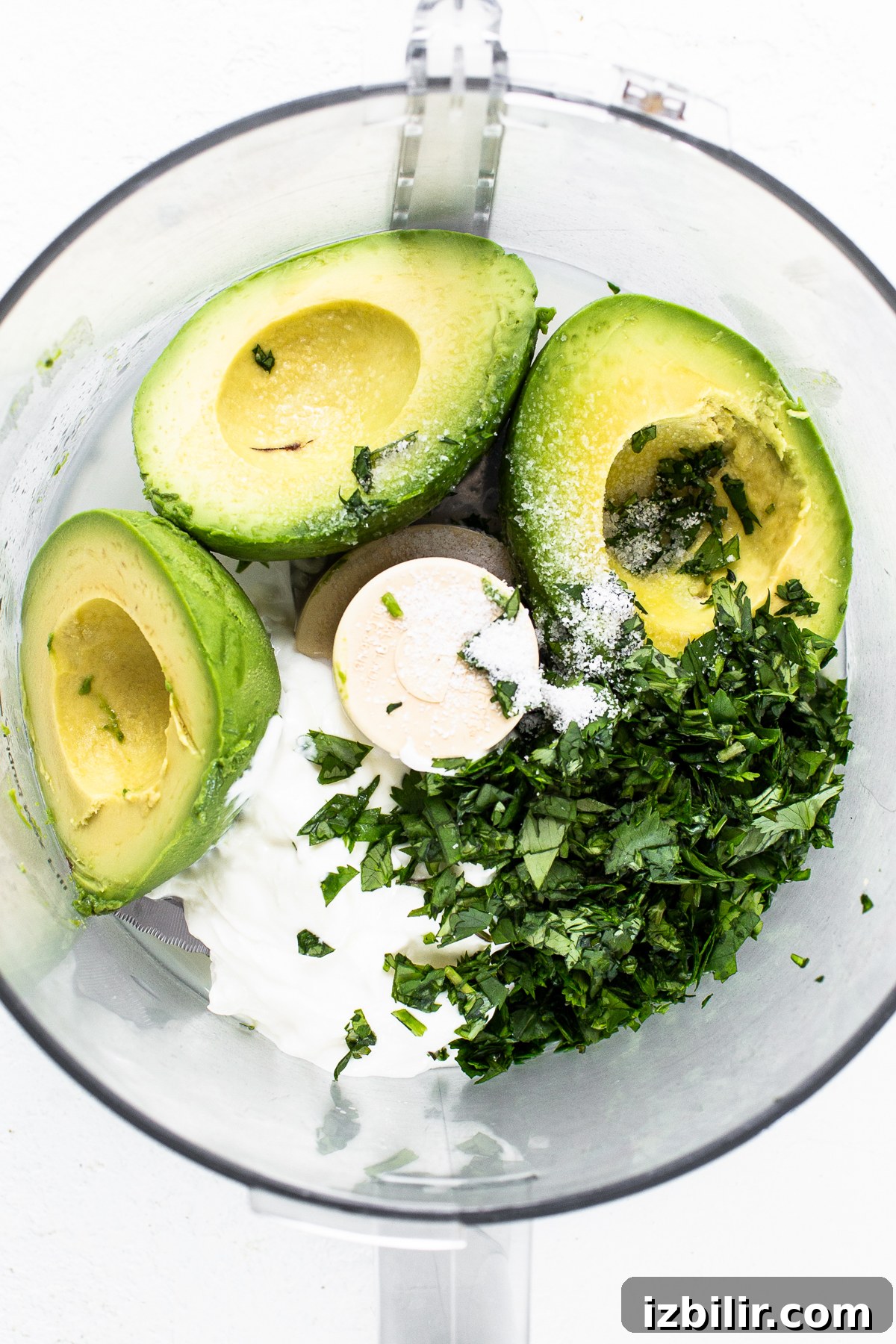 Quick Homemade Chilaquiles Recipe 4 avocado crema in food processor.