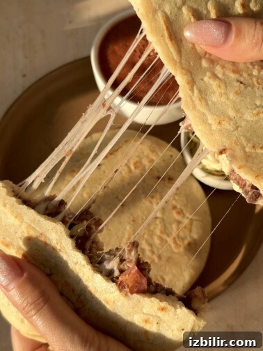 Breakfast pupusas on a griddle