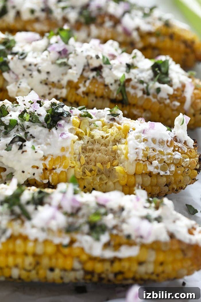 Grilled Mediterranean Street Corn with Feta 2 Mediterranean Grilled Street Corn with feta and basil on the cob