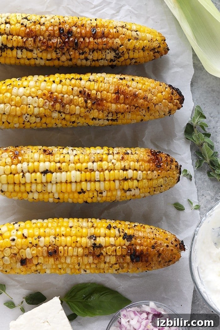 Grilled Mediterranean Street Corn with Feta 4 Close-up of grilled corn kernels with feta and basil