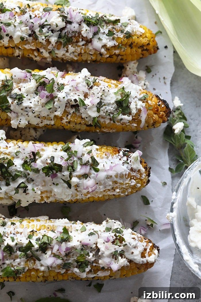 Grilled Mediterranean Street Corn with Feta 5 Mediterranean-style street corn with red onion and herbs