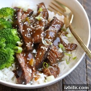 Sous vide flank steak and broccoli in a white bowl.
