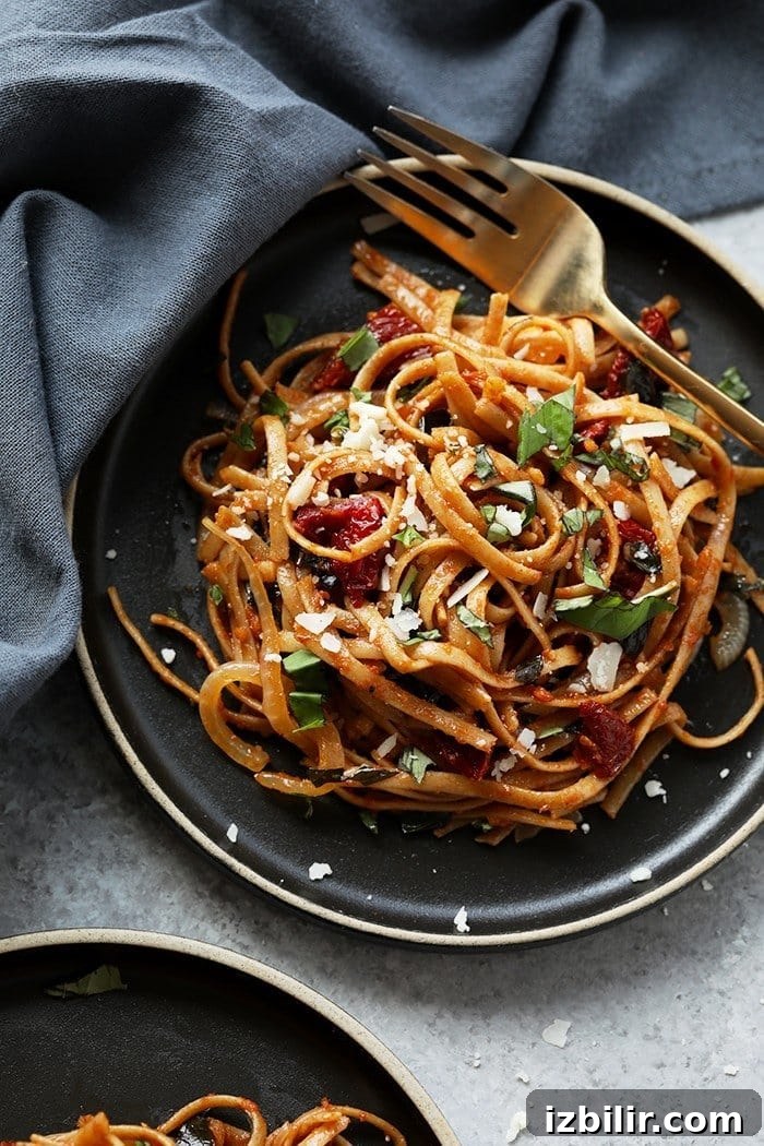 Pasta can be a healthy dinner packed with flavor and deliciousness. Substituting whole wheat pasta, adding vegetables, and creating a flavorful sauce is the key a healthy pasta for dinner. Treat yourself to this Whole Wheat Sun Dried Tomato Basil Pasta. It's light, fresh, and only require a few simple ingredients! vegetarian sun dried tomato pasta with fresh parmesan