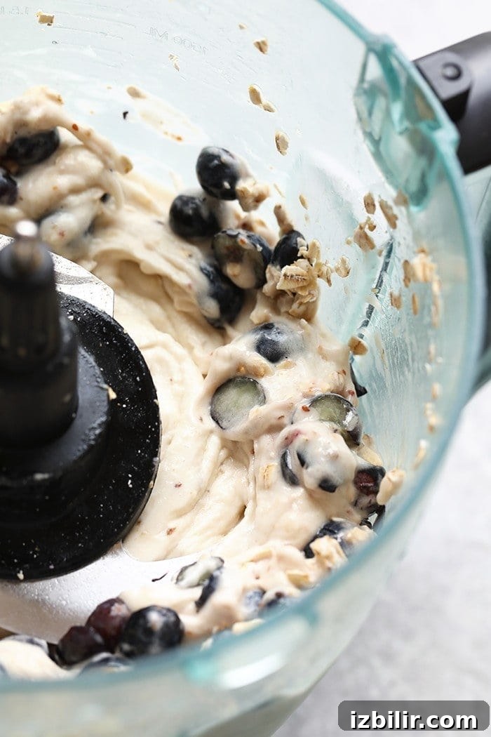 Cool off this summer with this Vegan Blueberry Muffin Banana Soft-Serve. It is naturally sweetened, delicious, and made with only six ingredients!