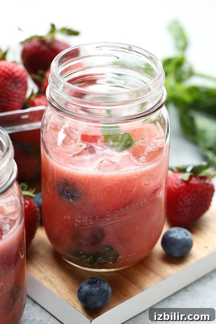 Strawberry Basil Kombucha Mocktail - a refreshing summer drink made with strawberries, basil, kombucha and orange juice.