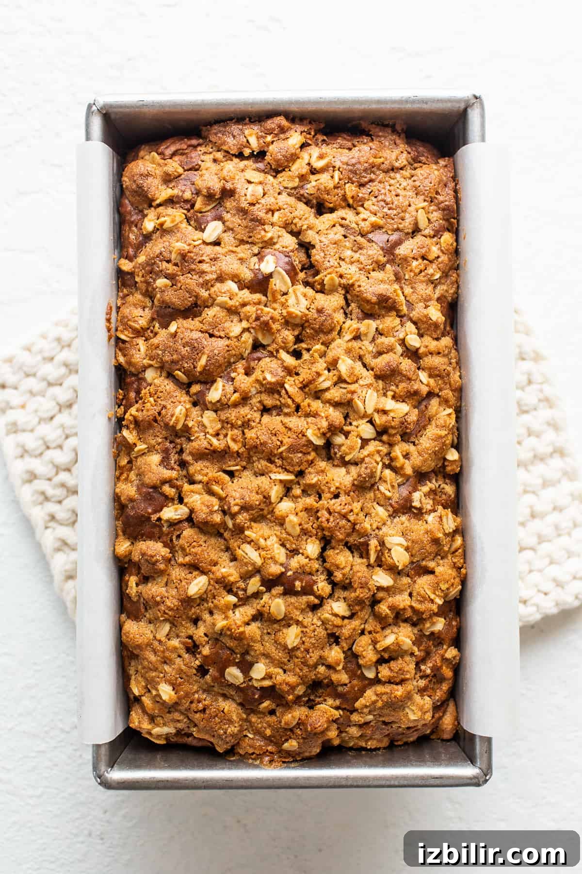 Sliced peanut butter apple streusel bread cooling