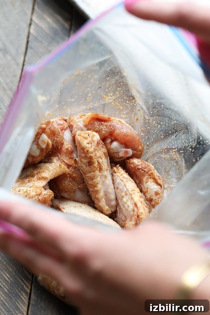 Crispy Baked Buffalo Chicken Wings Recipe 3 Unbaked chicken wings in ziploc bag with spices