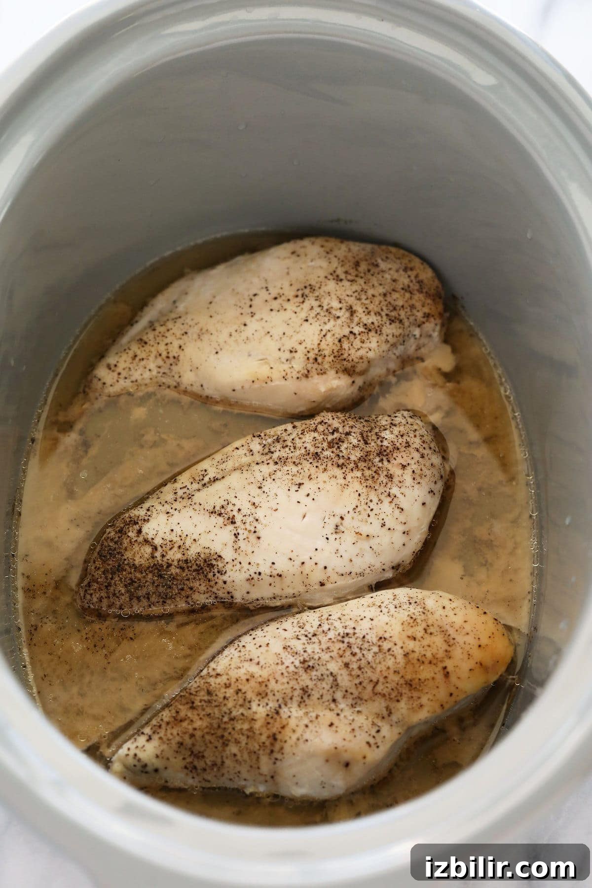 Crockpot Shredded Chicken for Tacos and Sandwiches 6 cooked chicken in slow cooker