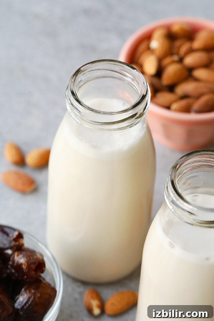 Homemade almond milk ready to serve. homemade almond milk in a jug ready to be served