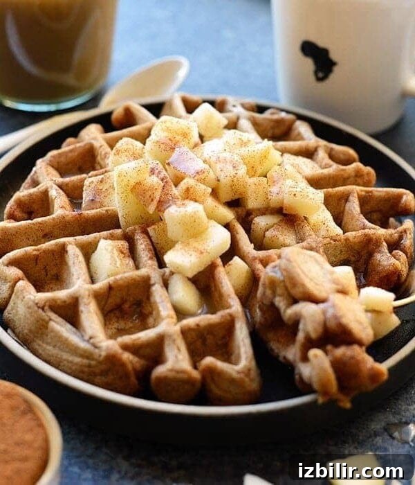 Apple cinnamon waffles on a plate.