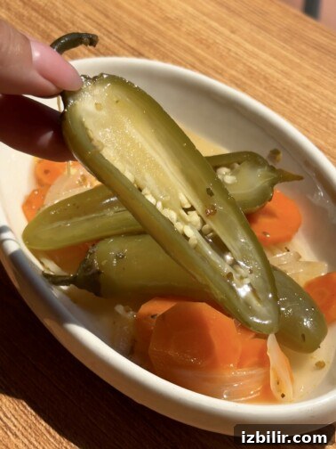 Escabeche pickled vegetables in a jar—jalapeños, carrots, and onions