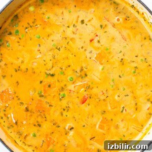 Creamy Thai Coconut Curry Soup with Lime and Ginger 11 A bowl of soup in a blue pot.