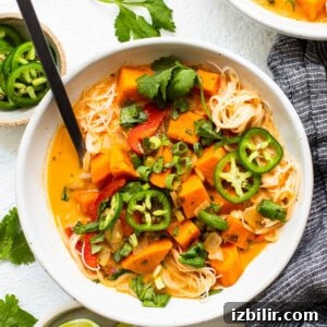 Creamy Thai Coconut Curry Soup with Lime and Ginger 13 A bowl of thai sweet potato noodle soup.