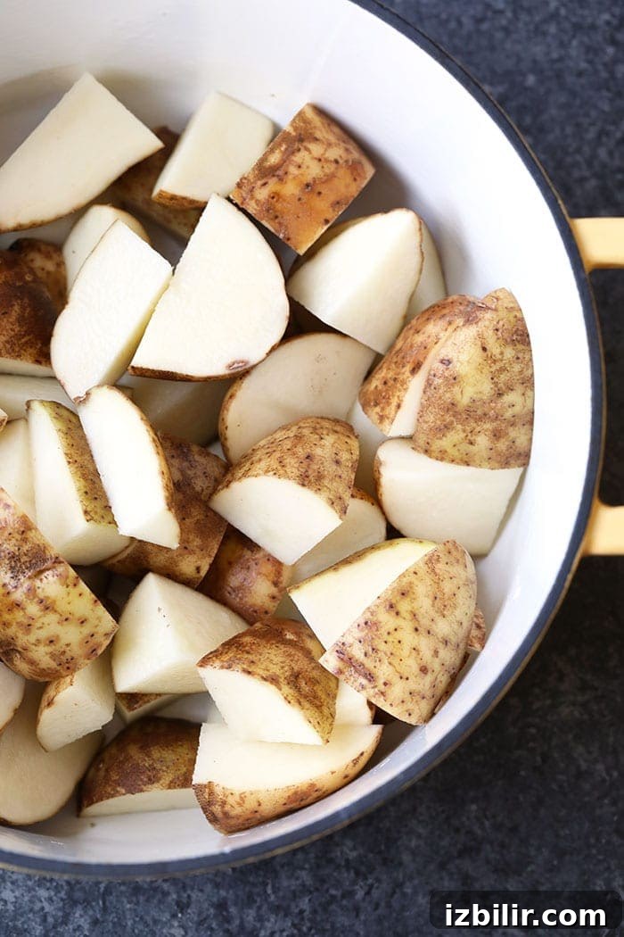 raw potatoes in pot