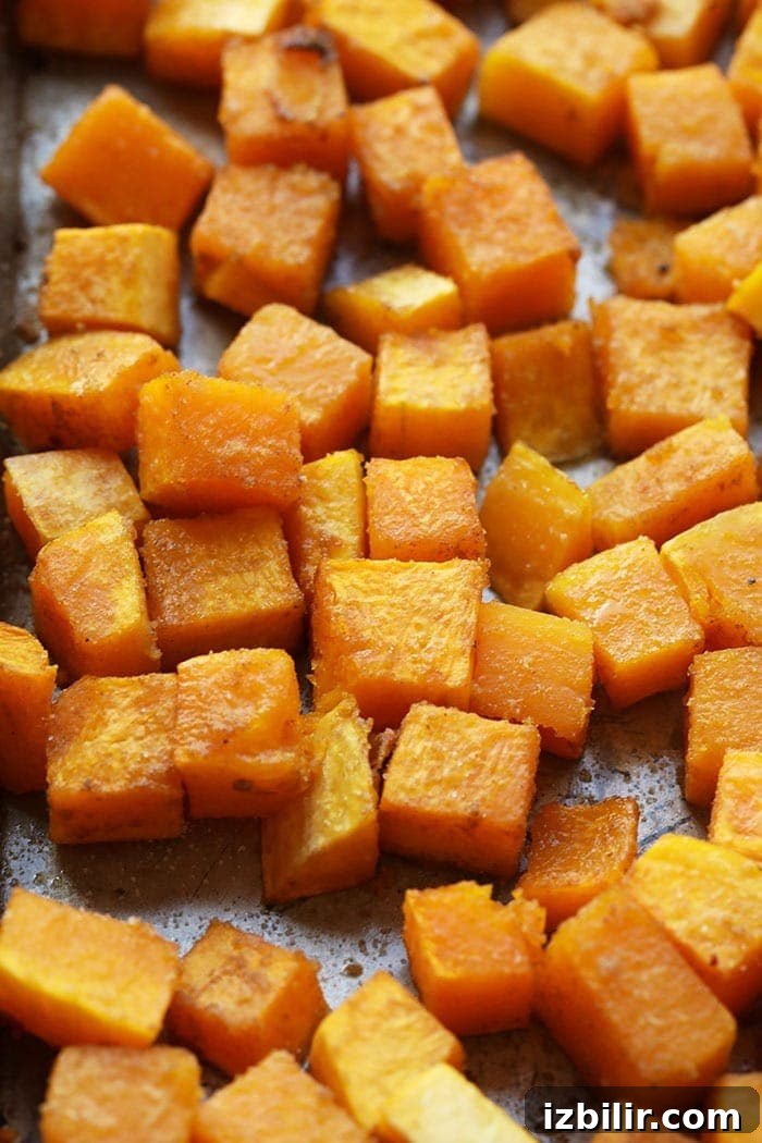 Cubed roasted butternut squash on a tray