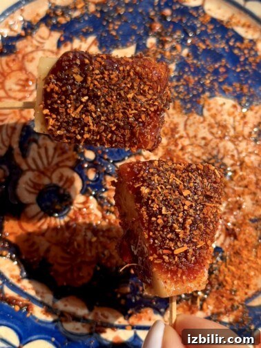 Mexican Candy Tanghulu - fruit skewers coated in glossy tamarindo candy and sprinkled with Tajín