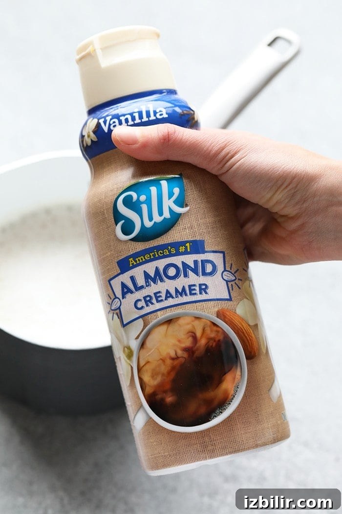 Who needs to go to a coffee shop when you can make your own luscious latte at home without an espresso machine! You're going to love this DIY Maple Pecan Latte made with cold brew and Vanilla Silk Almond Creamer.