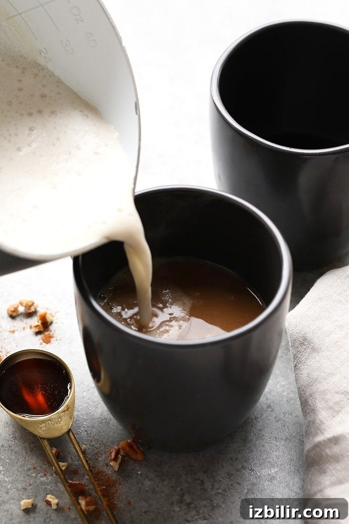 Who needs to go to a coffee shop when you can make your own luscious latte at home without an espresso machine! You're going to love this DIY Maple Pecan Latte made with cold brew and Vanilla Silk Almond Creamer.