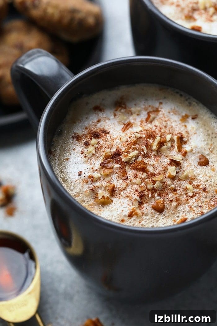 Who needs to go to a coffee shop when you can make your own luscious latte at home without an espresso machine! You're going to love this DIY Maple Pecan Latte made with cold brew and Vanilla Silk Almond Creamer.