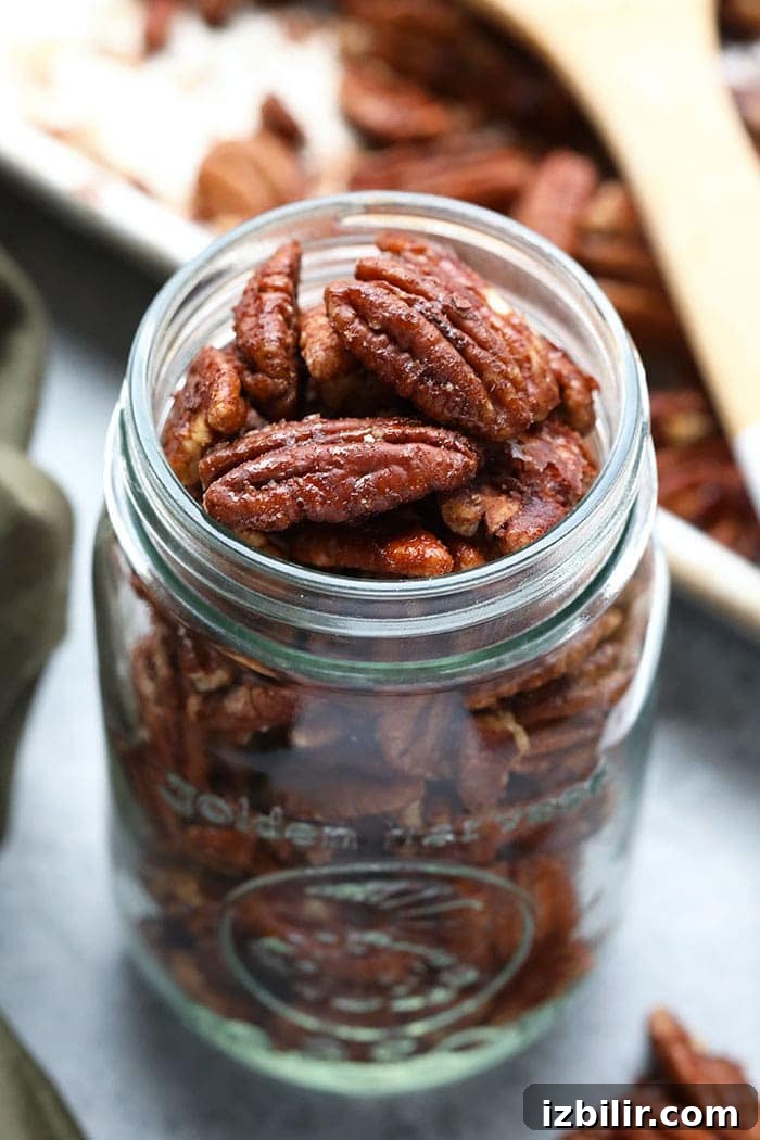 Maple Roasted Pecans Roasted pecans in a jar.